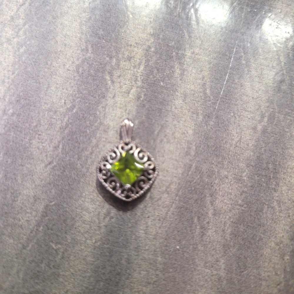 Dainty sterling silver charm with green stone